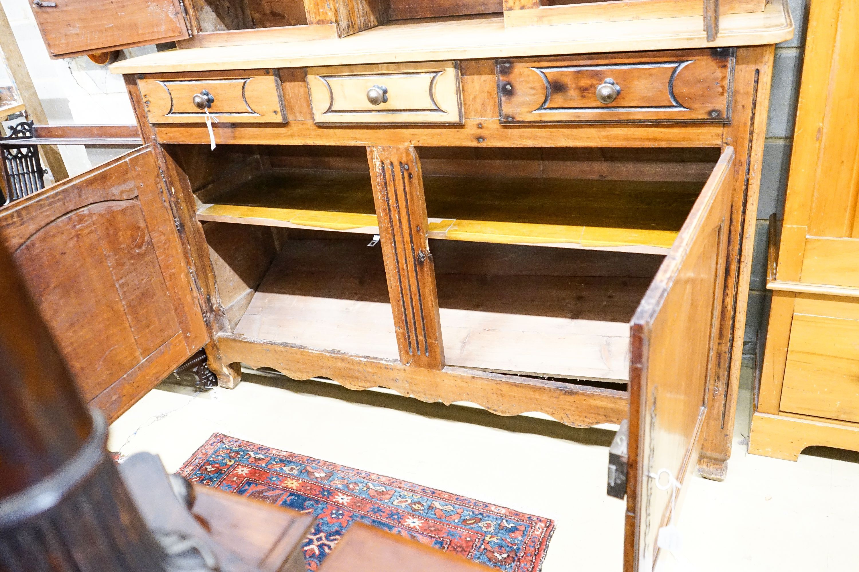 A late 18th / early 19th century French fruitwood dresser, length 160cm, depth 57cm, height 240cm